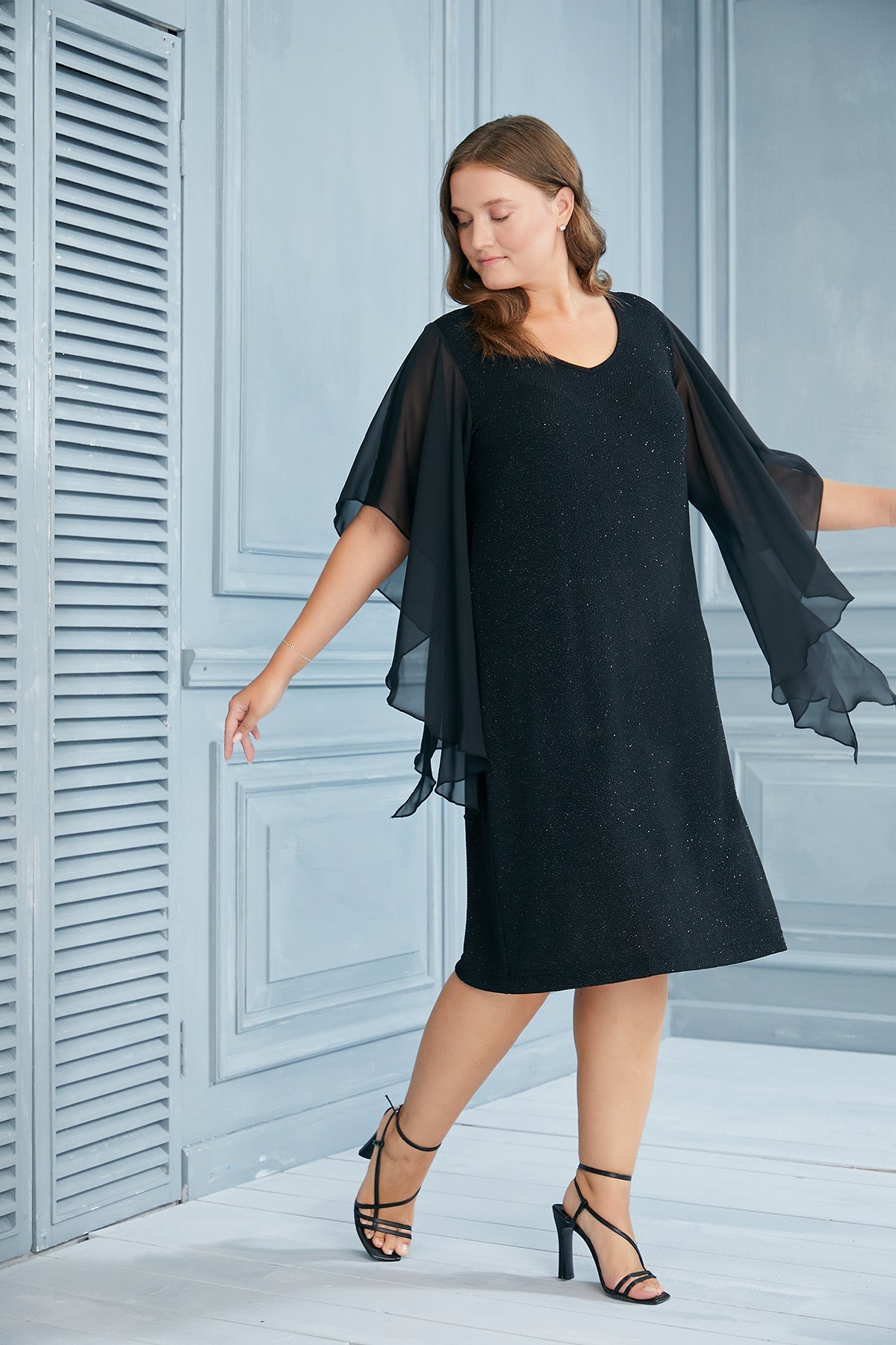 Plus size holiday dress with angel sleeves